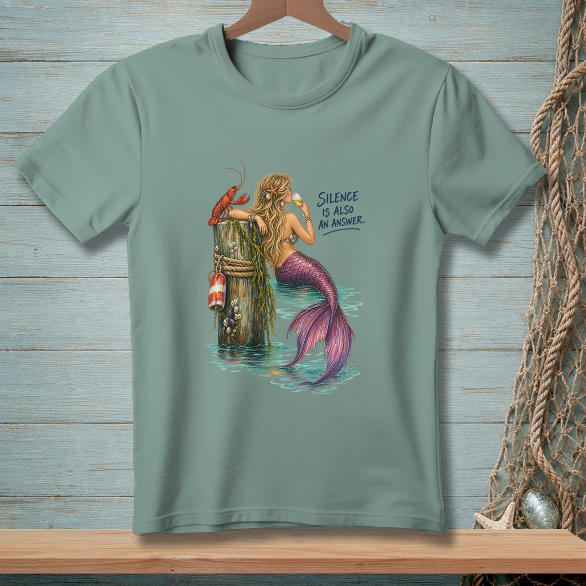 Mermaid with lobster and buoy on pier, "Silence is Also An Answer."