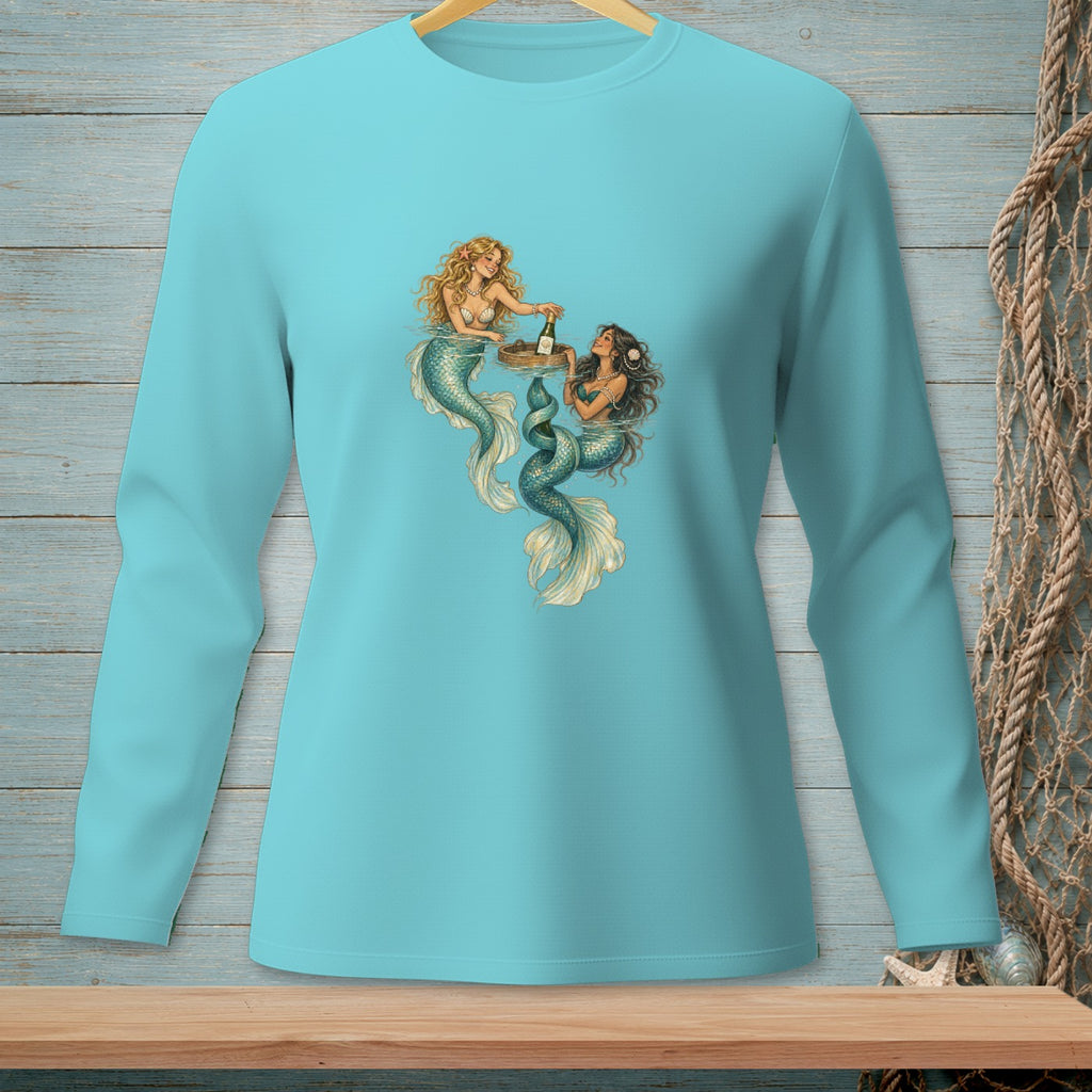 Two mermaids in water with a tray of champagne, printed on a turquoise long-sleeve shirt.