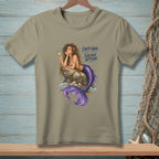 Mermaid on rock with cocktail, text: Salty Hair. Saltier Attitude.