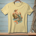 Yellow t-shirt with a vintage mermaid illustration on a rock surrounded by crabs and ocean waves.