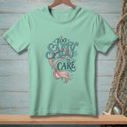 Mint green t-shirt with "Too Salty to Care" mermaid tail graphic.