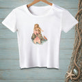 White t-shirt with illustration of a blonde mermaid with a pink tail sitting on a rock.