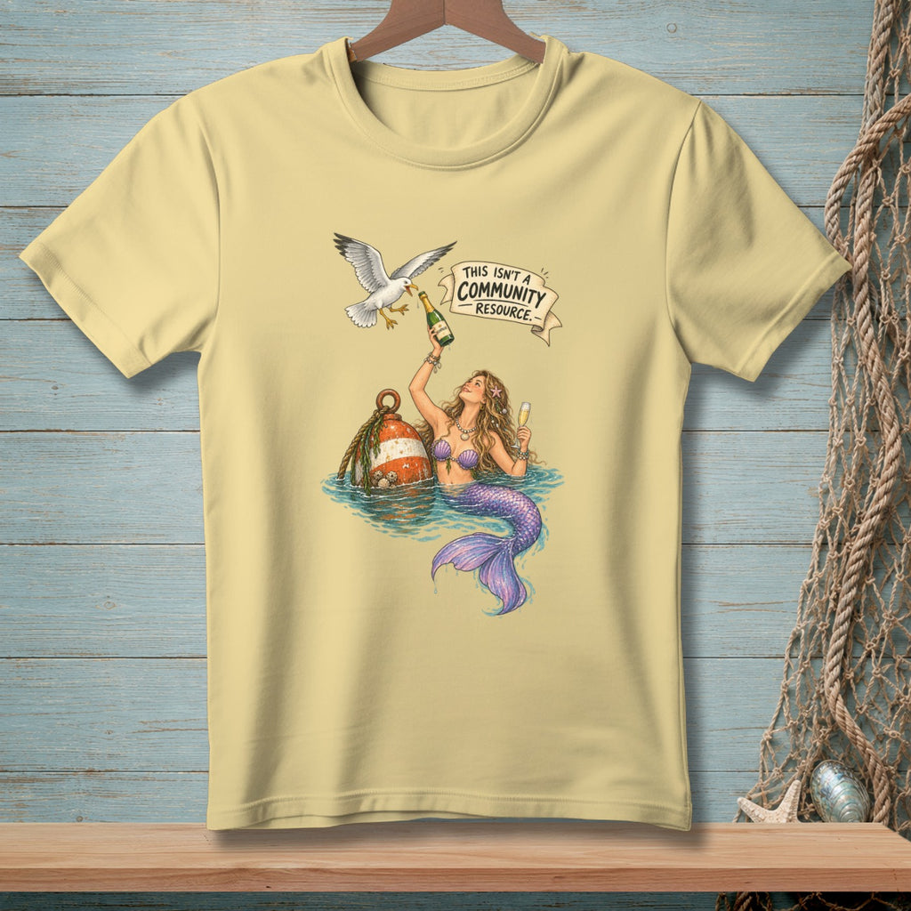 T-shirt graphic of mermaid with champagne and a seagull, with text "This Isn't a Community Resource".