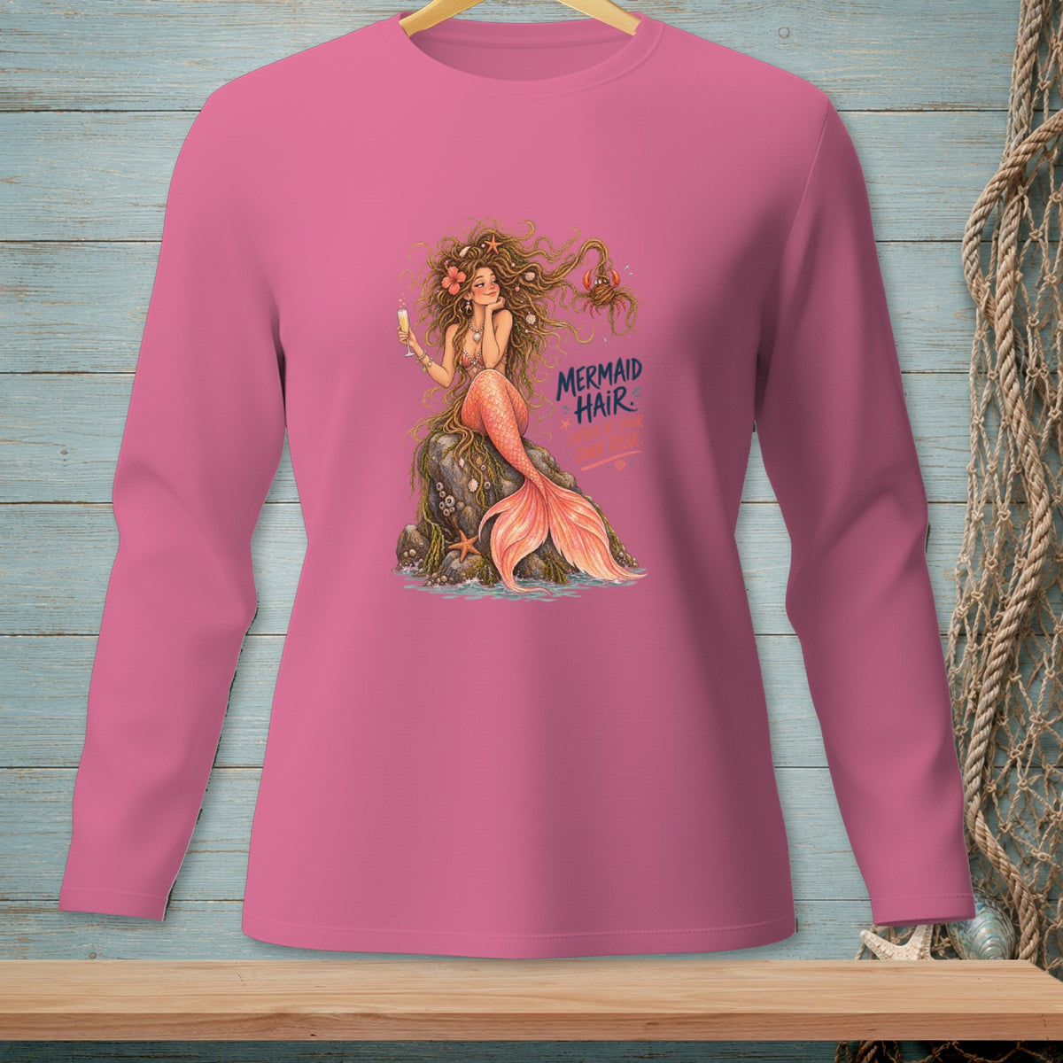 Pink long-sleeve shirt with a mermaid and the text "Mermaid Hair".