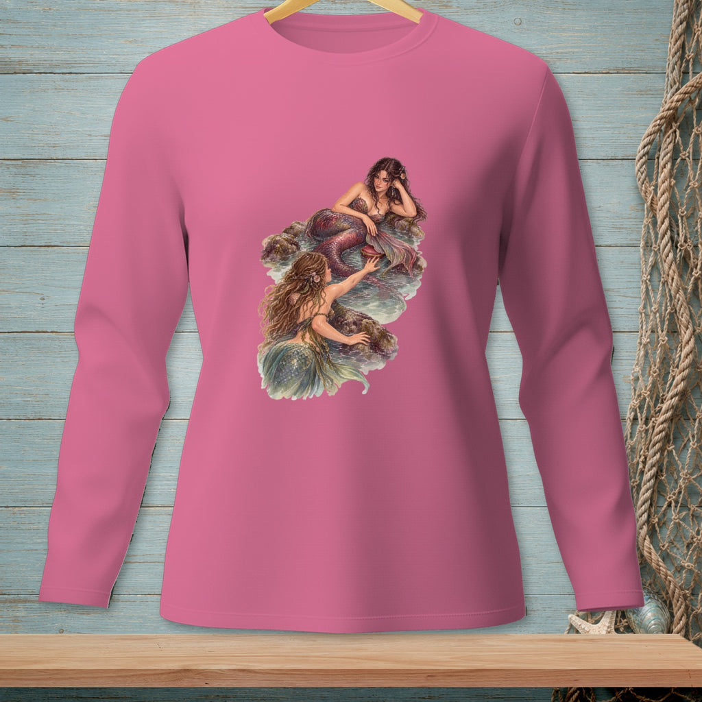 Pink long-sleeve shirt with a graphic of two mermaids on rocks.