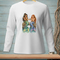 Two mermaids with tails sit on a wooden dock, one holding an apple and the other a bowl.