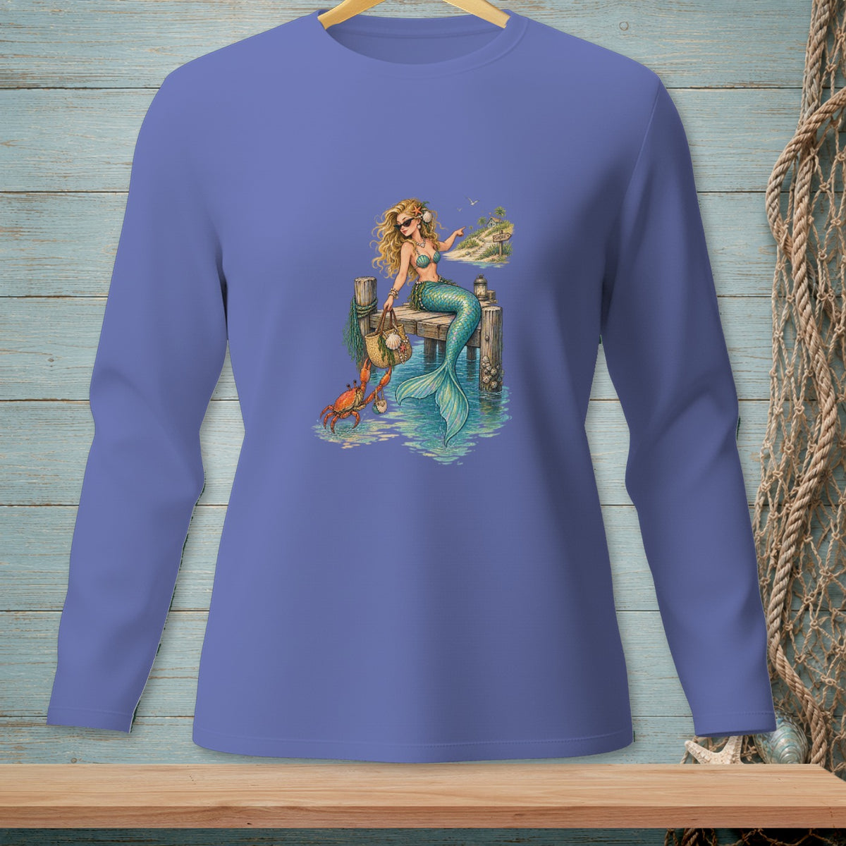 Mermaid with crab sits on a dock in the ocean.