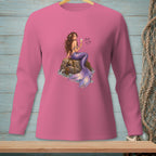 Pink long-sleeve shirt with a mermaid sitting on a rock, holding a champagne flute.