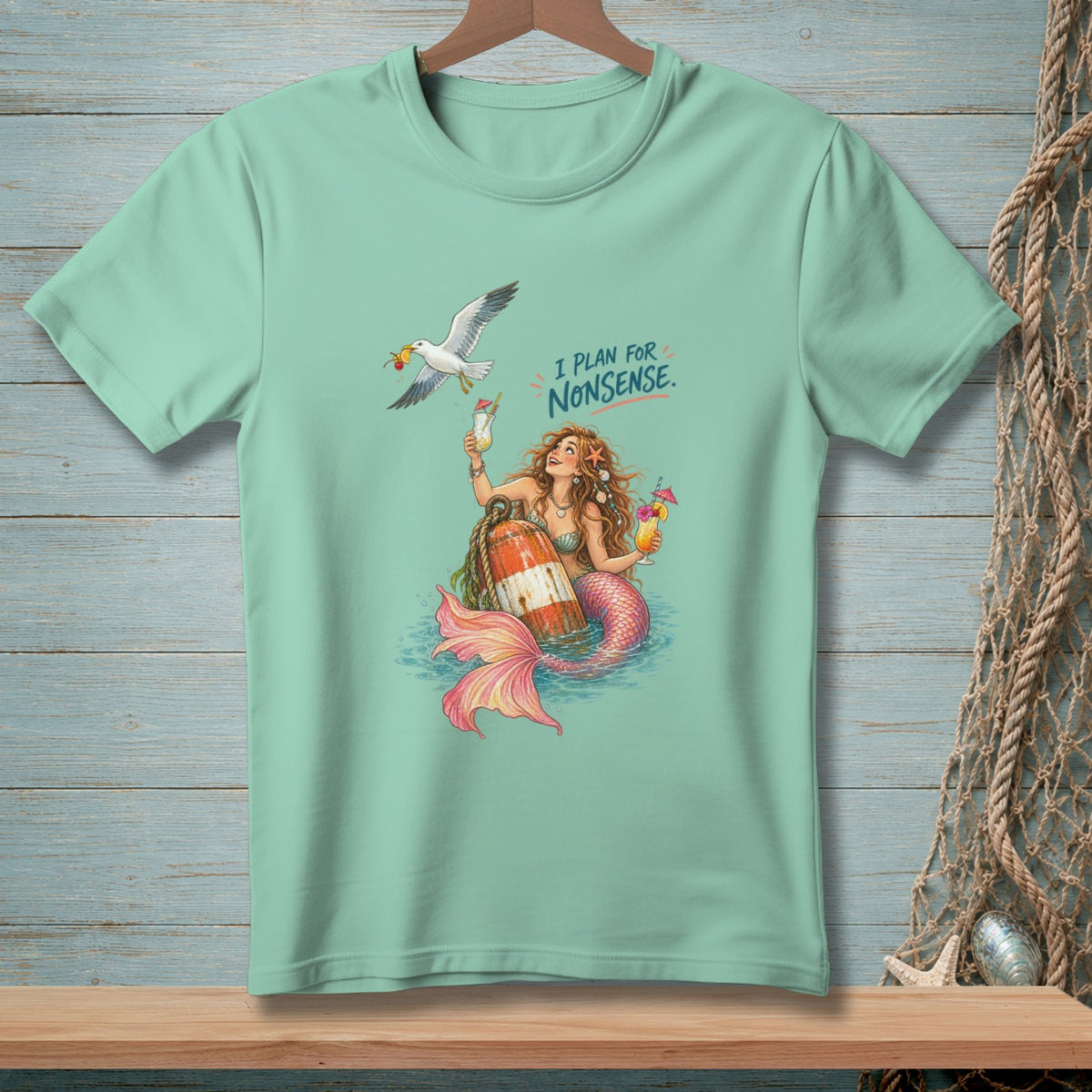 Mermaid with drinks and a seagull, with text "I PLAN FOR NONSENSE."
