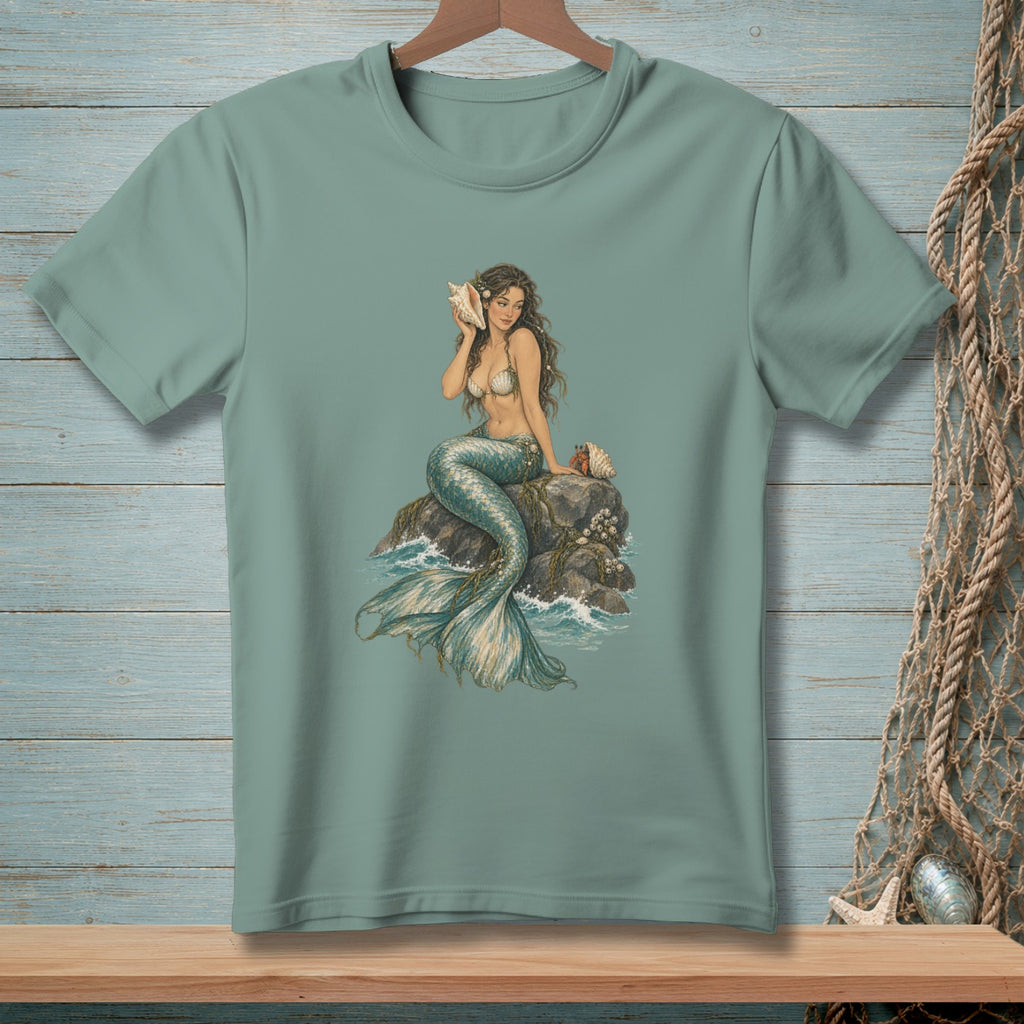 Mermaid holding seashell, sitting on a rock with waves and shells.