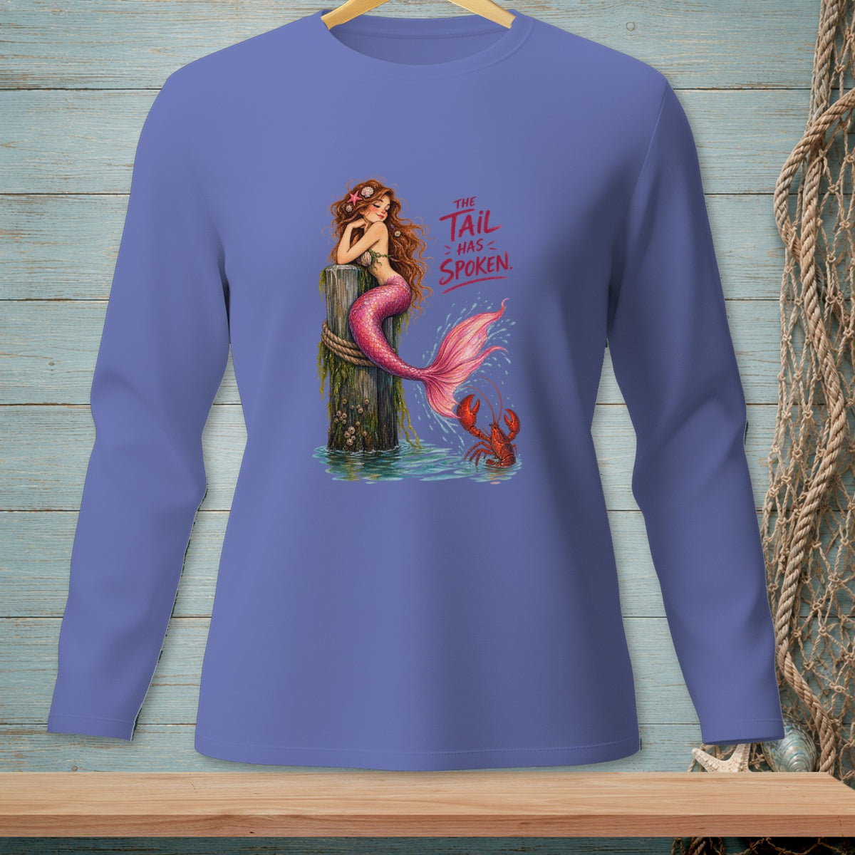 Mermaid on a post with text "The Tail Has Spoken" and a lobster.