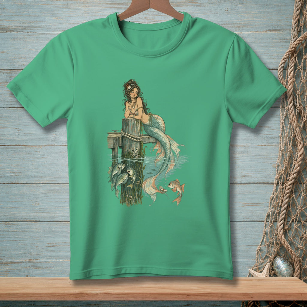 Mermaid with fish by wooden post and underwater scene graphic on green t-shirt.