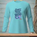 Long sleeve teal t-shirt with "Don't Test The Waters" and mermaid tail graphic.