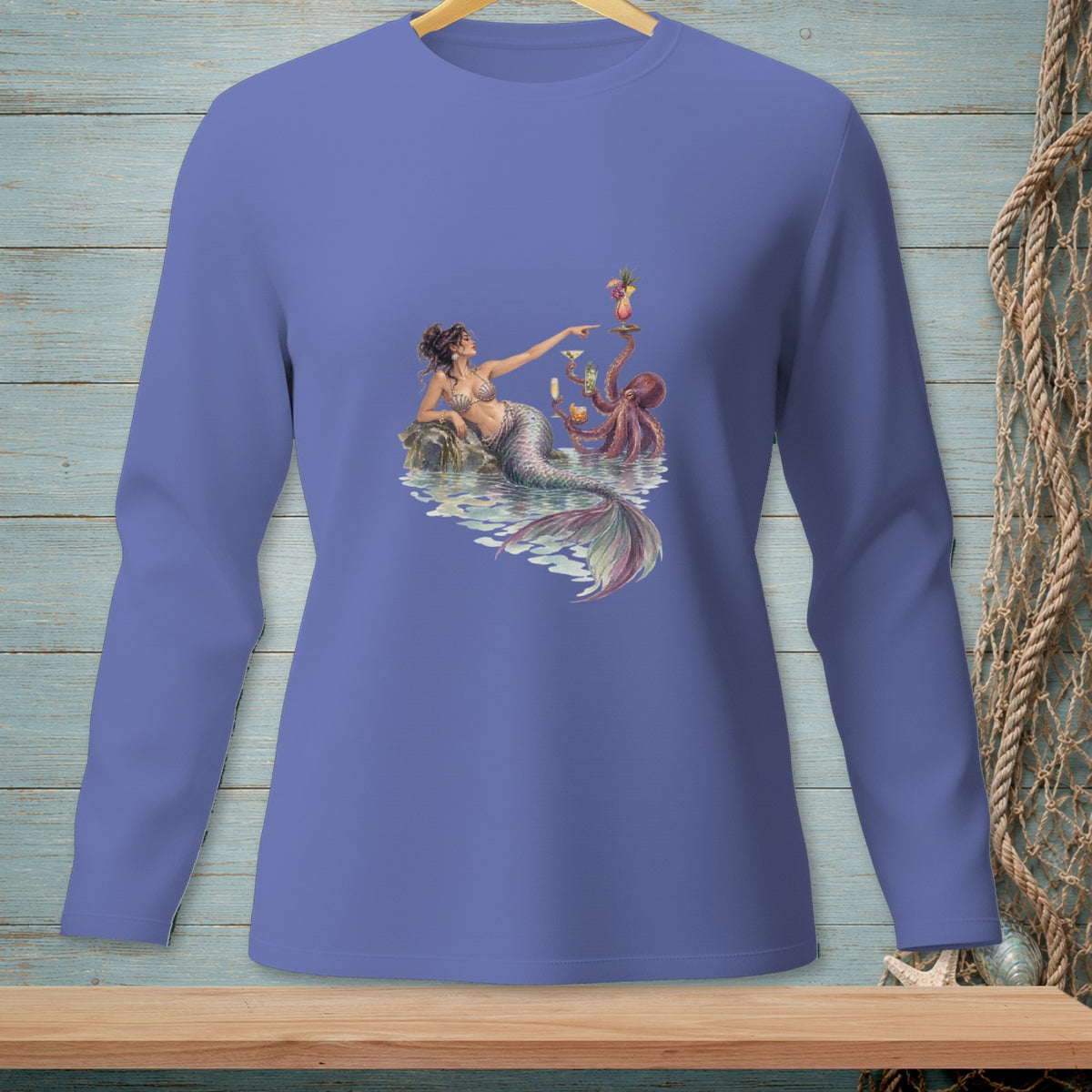Mermaid with octopus serves cocktails near sparkling water, detailed watercolor art on a purple long-sleeve shirt.