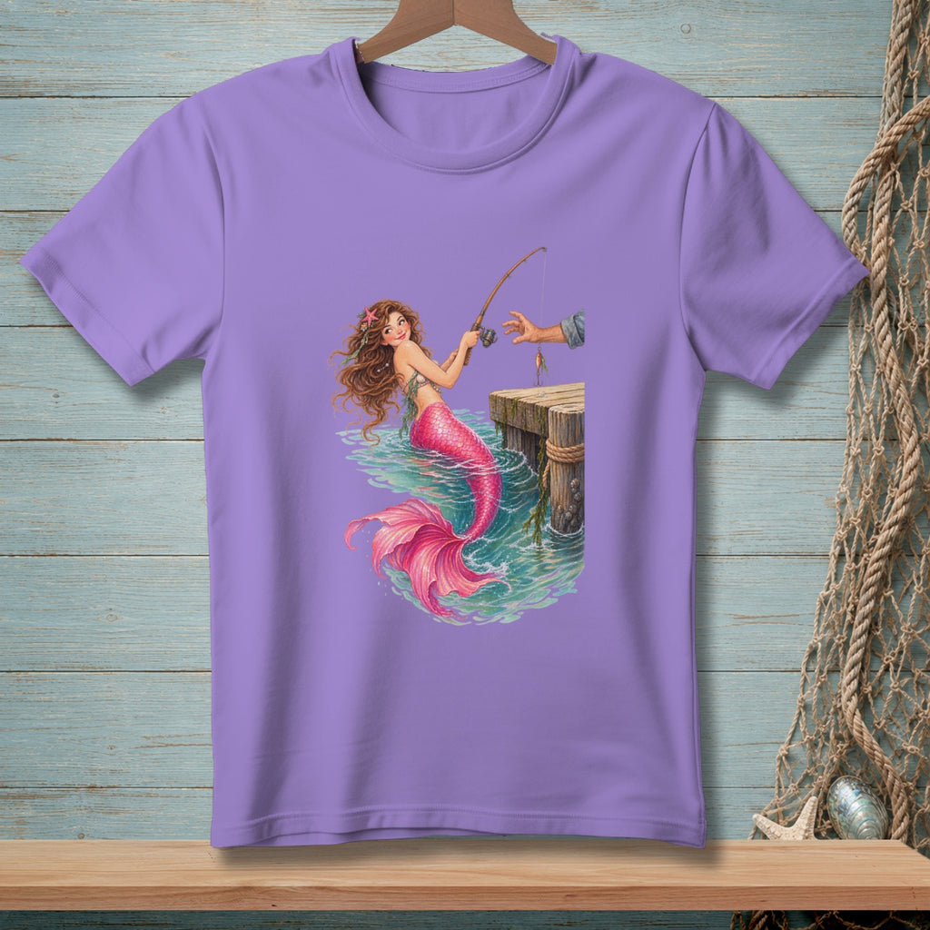 Purple t-shirt with a mermaid fishing from a wooden pier.