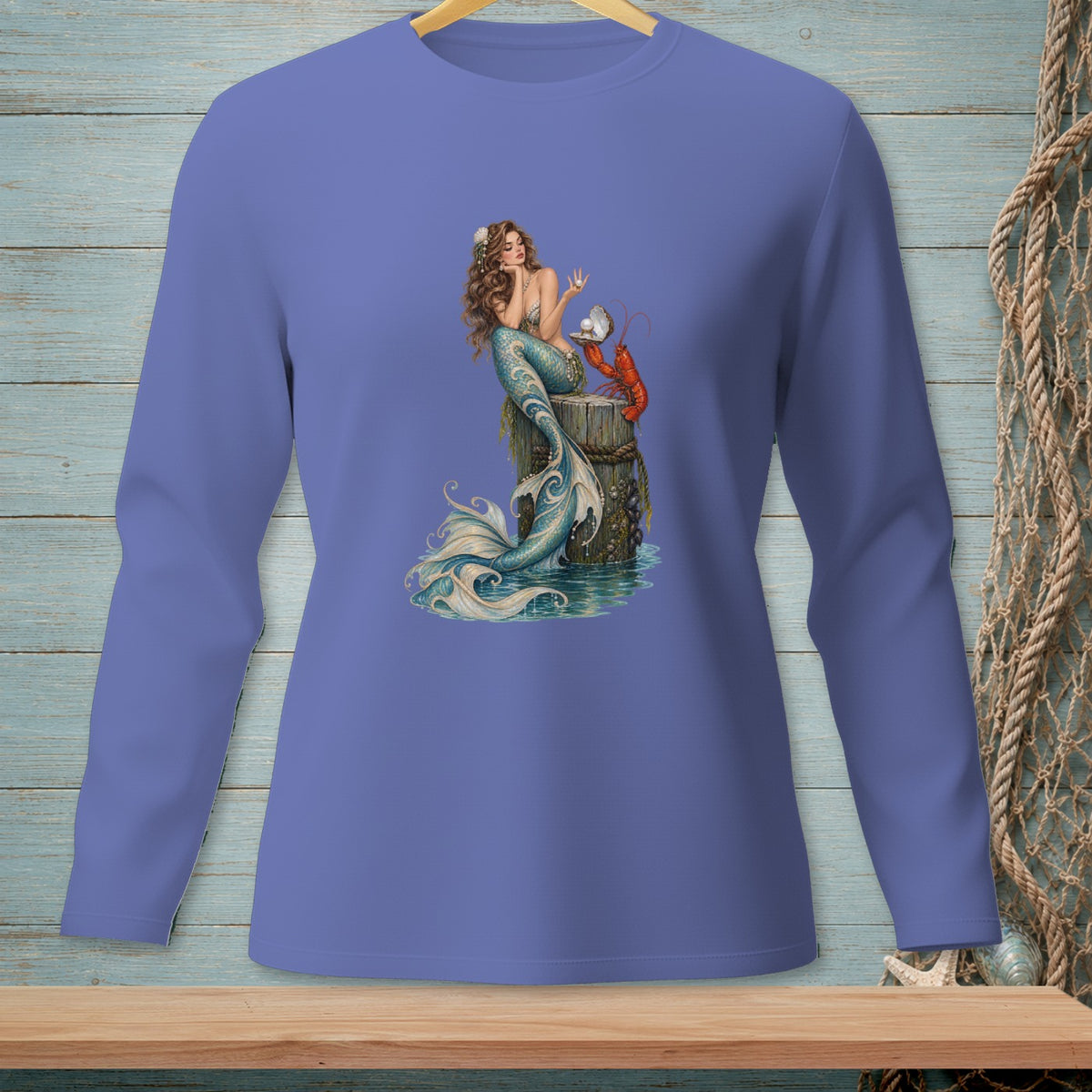 Mermaid holding a pearl with a lobster on a pilings, printed on a long-sleeve shirt.