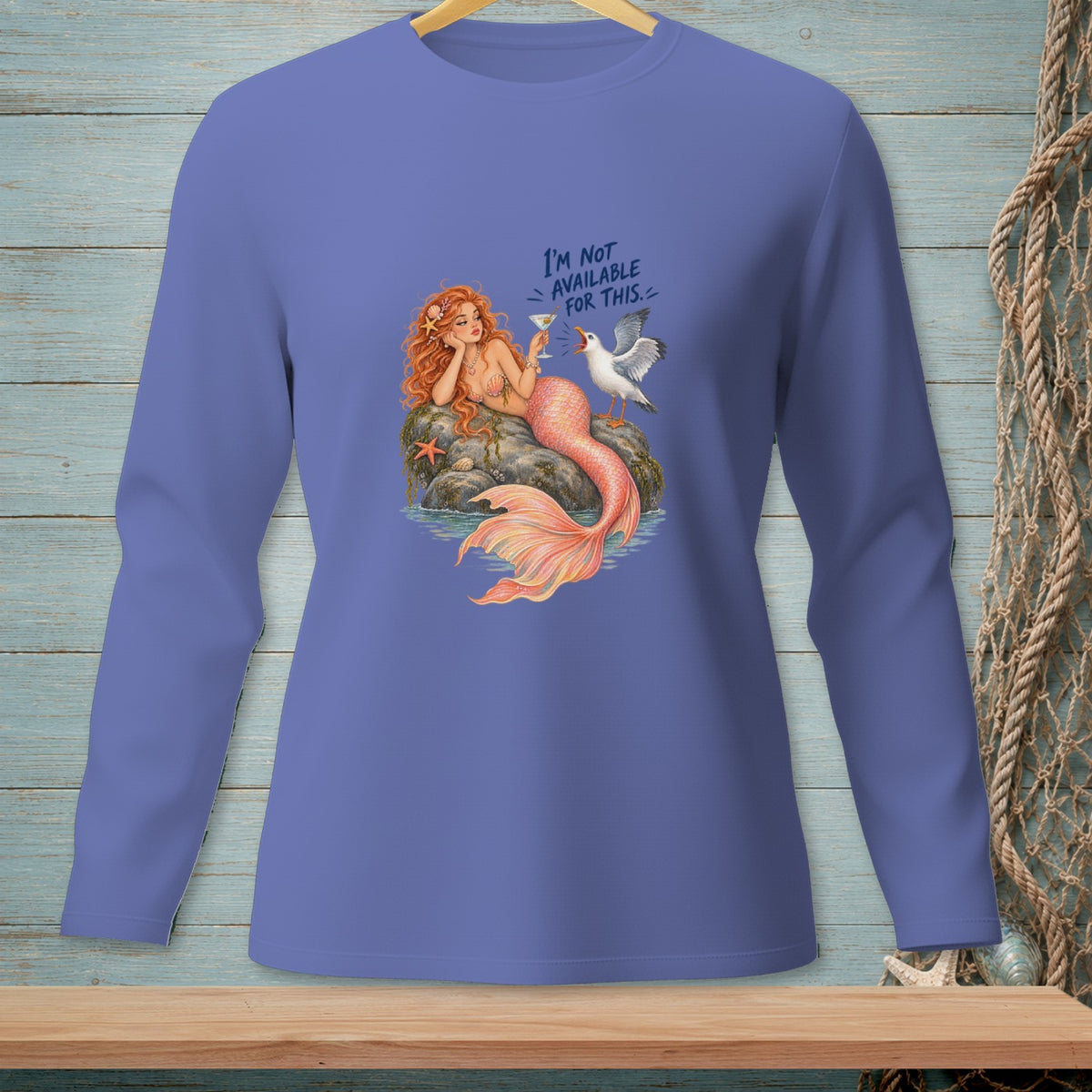 Mermaid holding a drink, talking to a seagull, text reads "I'm not available for this."