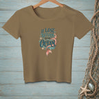 Tan t-shirt with "If Lost Return to the Ocean" text and mermaid tail graphic.