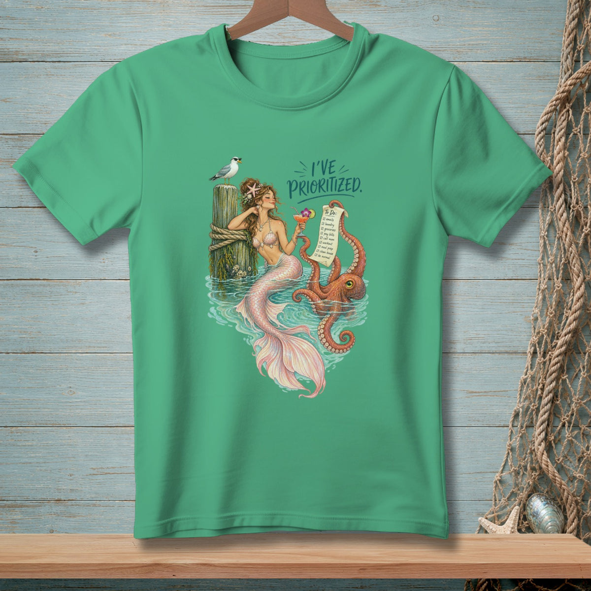 Mermaid holding a drink near octopus and to-do list, text "I've prioritized."