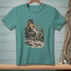 Teal t-shirt with a detailed illustration of a mermaid sitting on rocks by the sea.