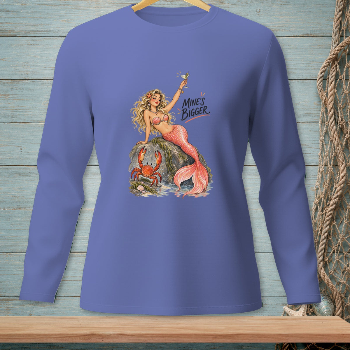 Purple long sleeve shirt featuring a mermaid and crab with text "MINE'S BIGGER."