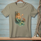 Mermaid holding seashell with crab on rock, next to a wooden post.