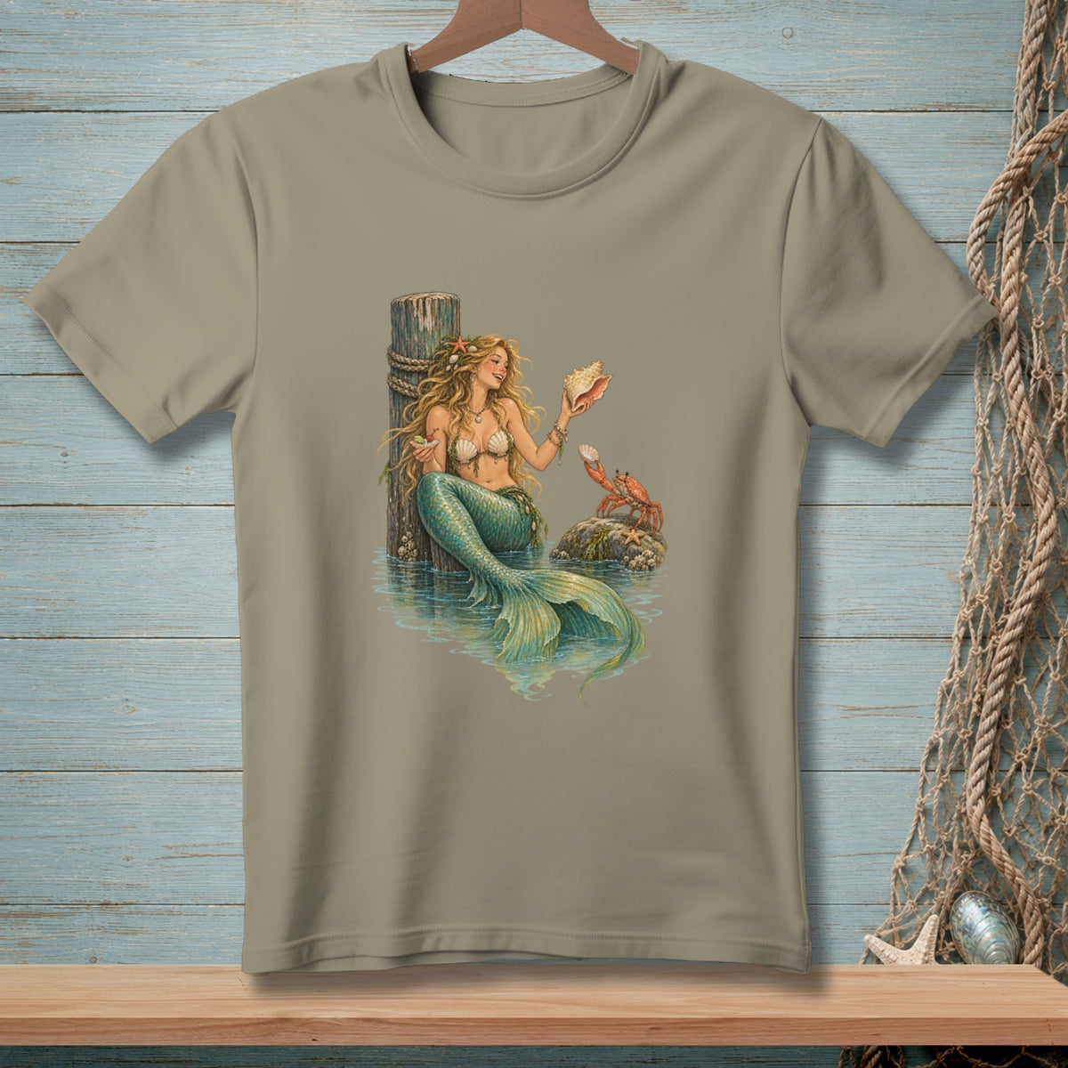 Mermaid holding seashell with crab on rock, next to a wooden post.