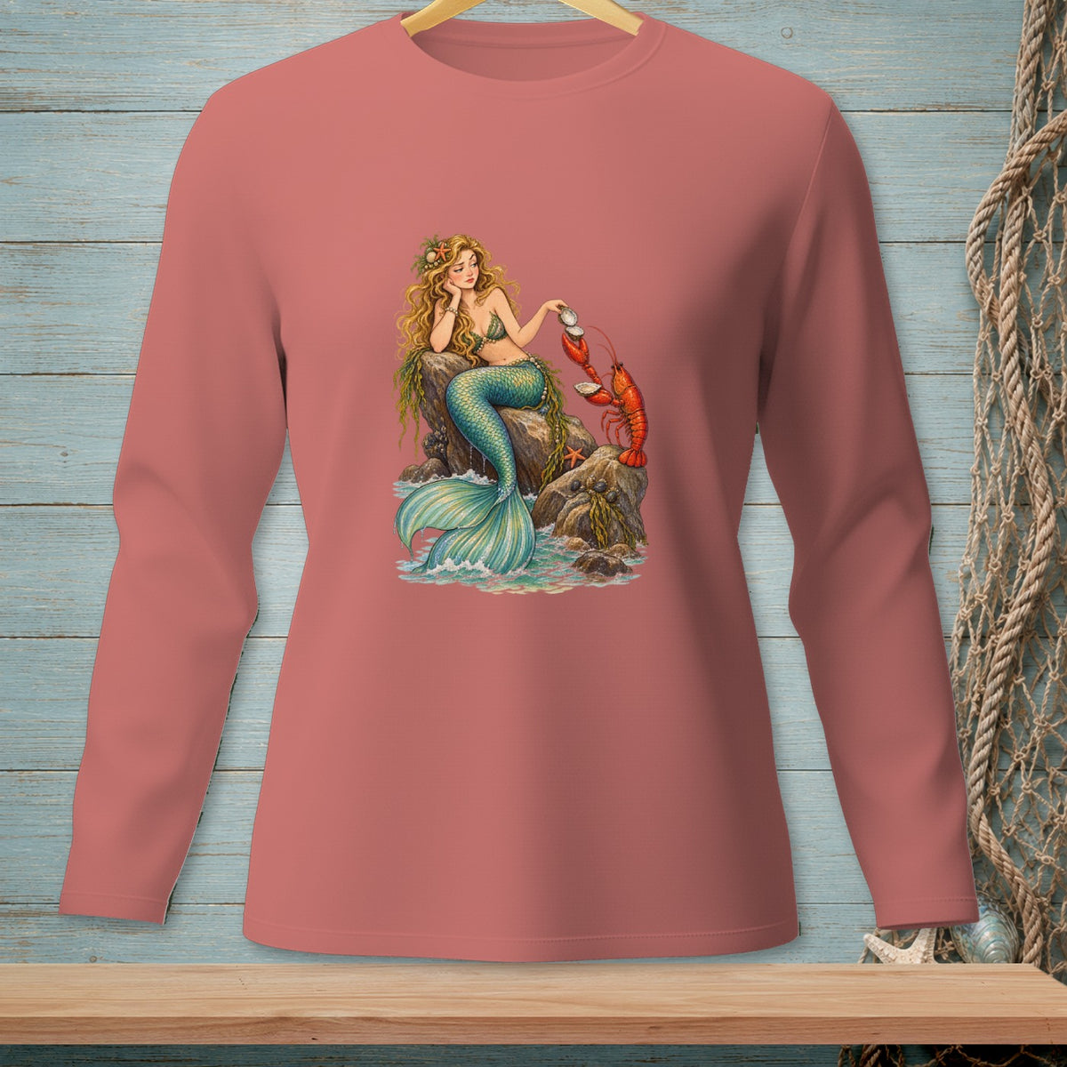 Illustration of mermaid with lobster on rocks by the sea.