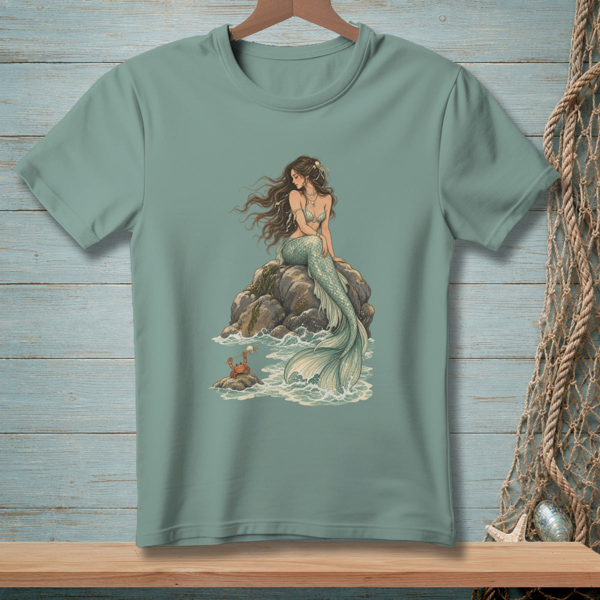 Mermaid sitting on rocks with a crab in the waves.