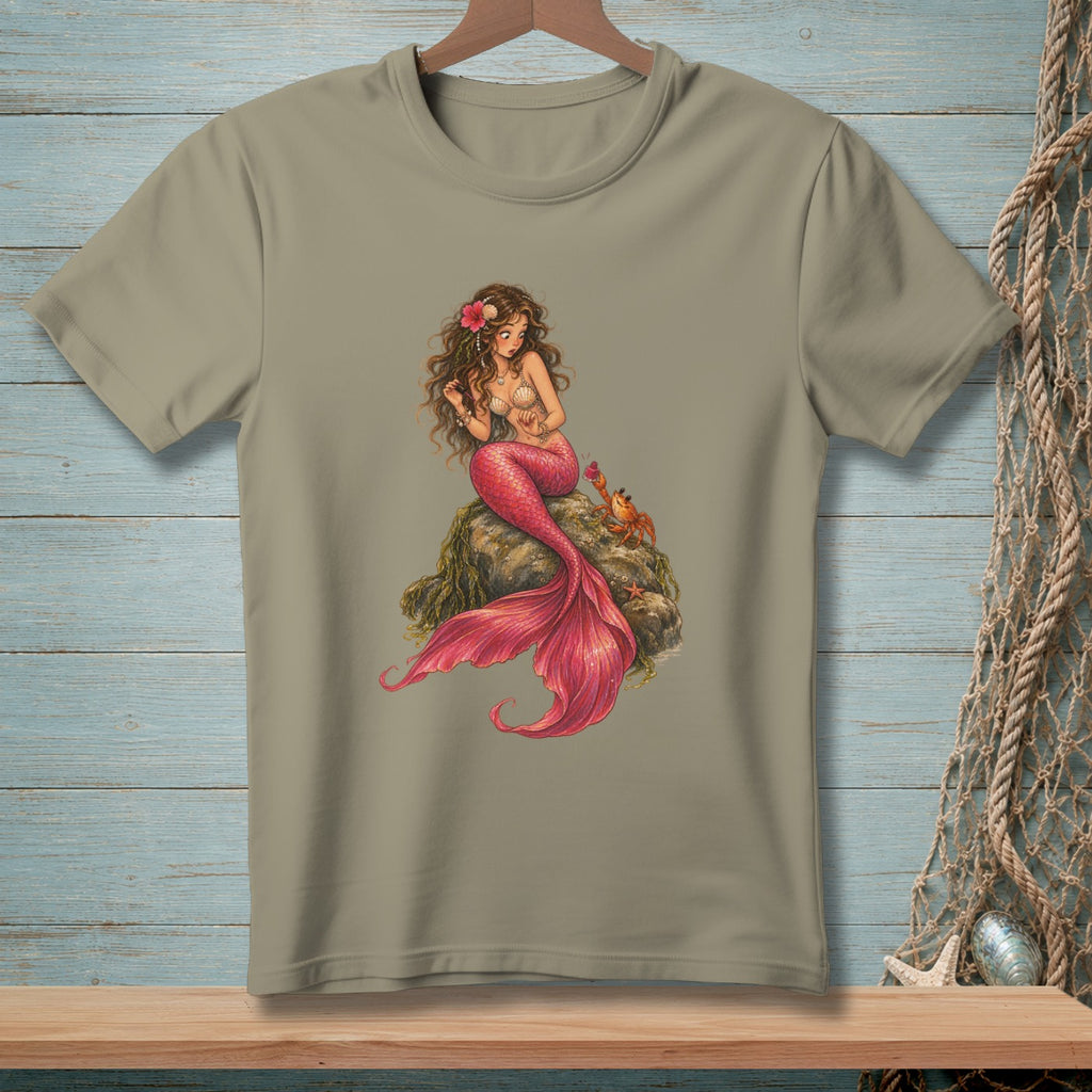 Brown-haired mermaid with pink tail sits on a rock with a crab and starfish.