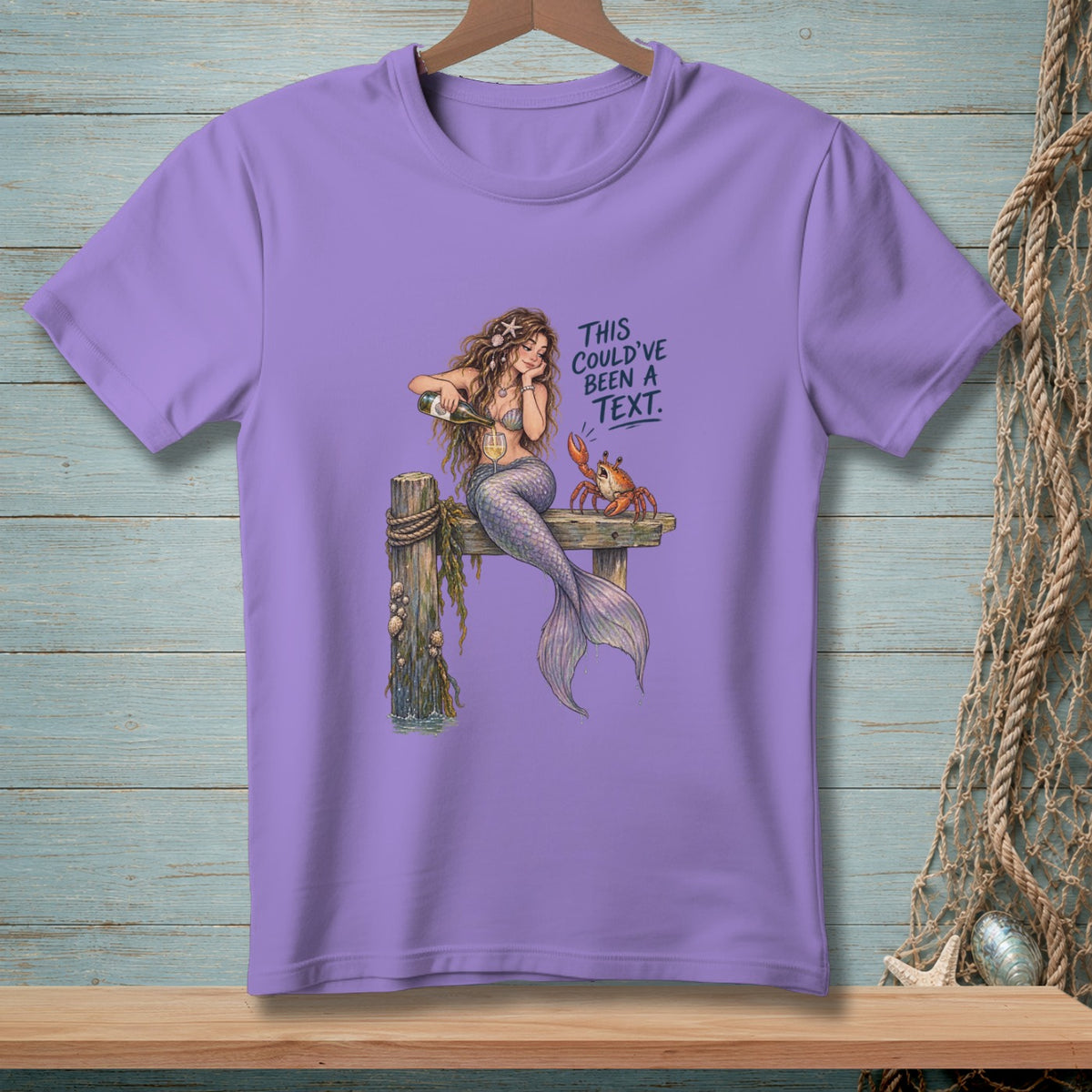 Purple t-shirt with mermaid, crab, and text "This could've been a text."