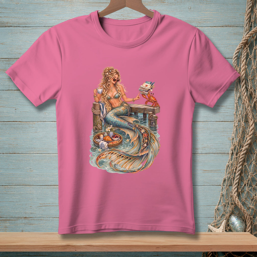 Illustration of a mermaid holding coffee and books on a pier with a crab.