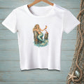 White t-shirt with illustration of a mermaid holding a drink on a wooden post.
