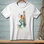 White t-shirt with a mermaid holding a cocktail and leaning on a post with a "No Drinking" sign.