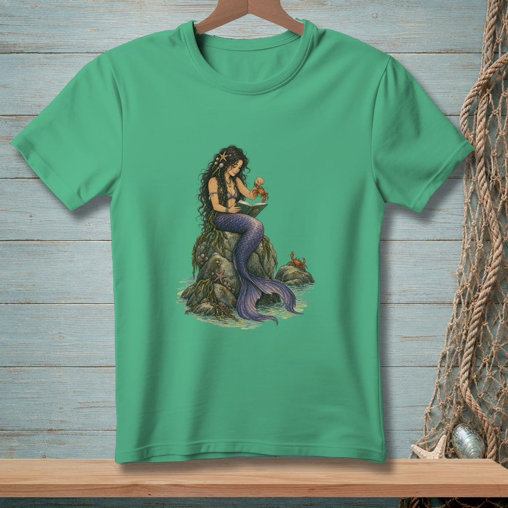 Mermaid reading a book on a rock with crabs and starfish in the ocean.