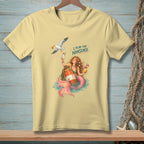 Yellow t-shirt with mermaid and seagull design, saying "I PLAN FOR NONSENSE."