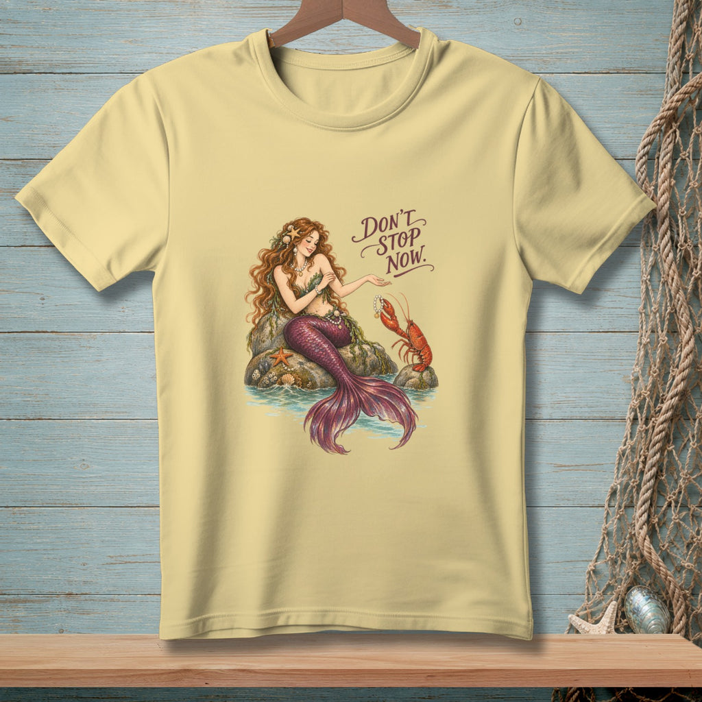 Light yellow t-shirt with a mermaid and lobster graphic and text "Don't Stop Now."