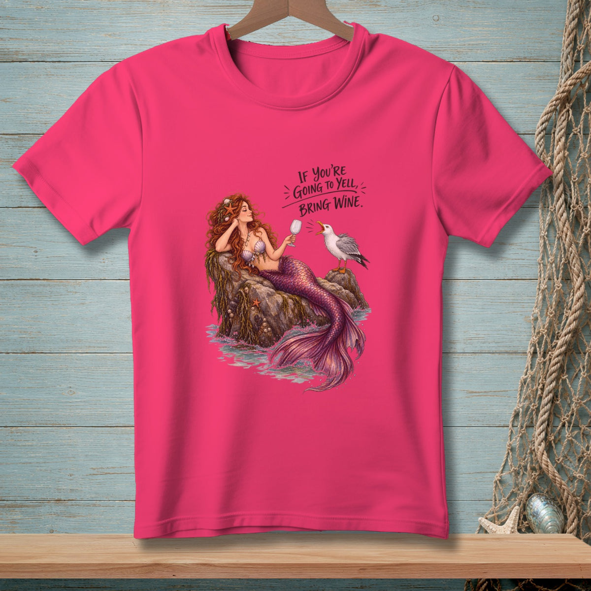 Mermaid holding wine glass with seagull and text "If you're going to yell, bring wine."