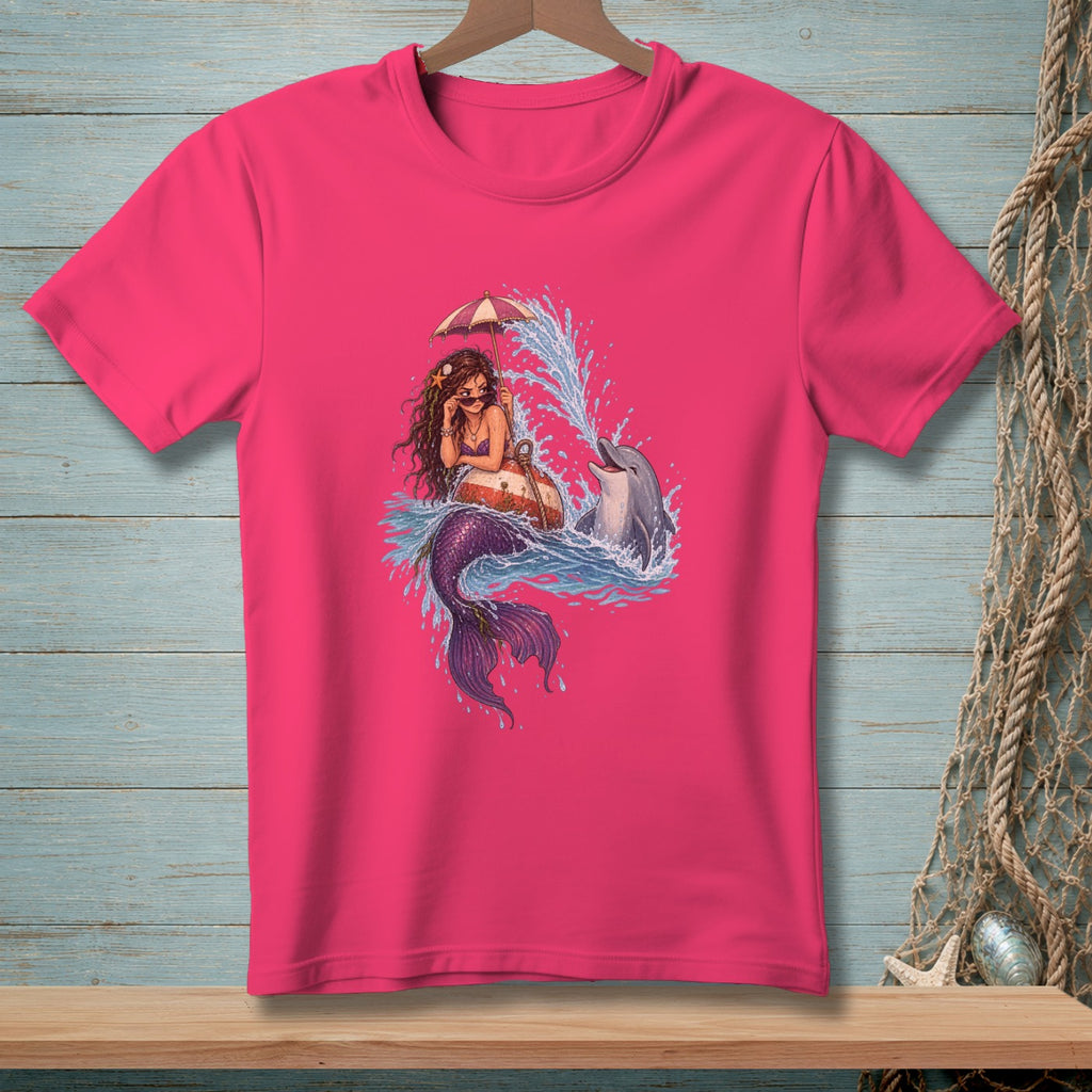 Mermaid with umbrella and dolphin splashing in water, on pink t-shirt.
