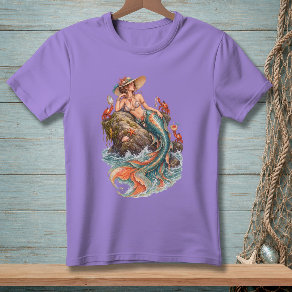 Purple t-shirt with a graphic of a mermaid sitting on a rock surrounded by crabs and waves.