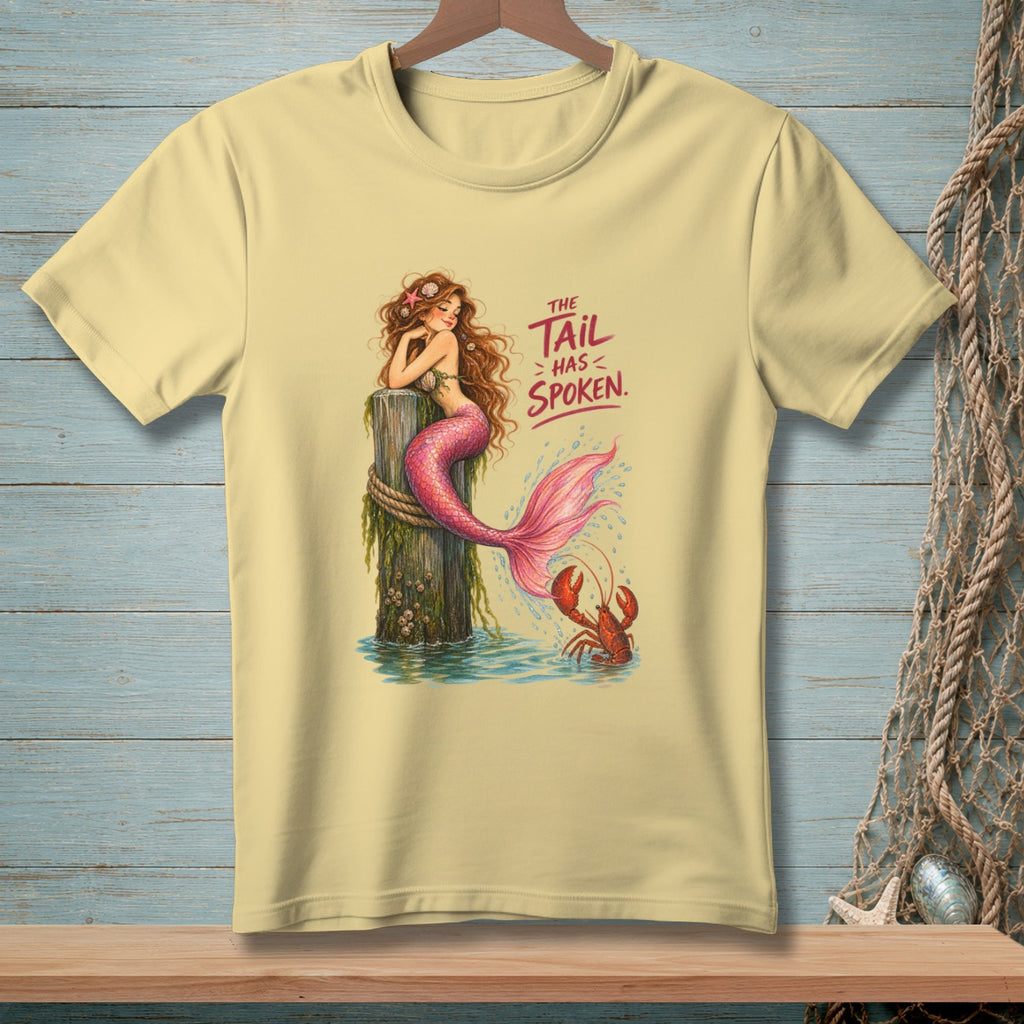 A mermaid sits on a post with a lobster and the text "The Tail Has Spoken."