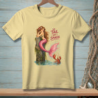 A mermaid sits on a post with a lobster and the text "The Tail Has Spoken."