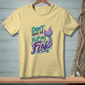 Pale yellow t-shirt with "Don't Make Me Flip My Fin" text and mermaid tail graphic.
