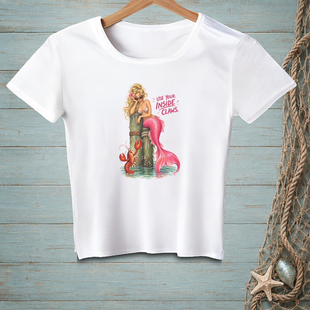 White t-shirt with graphic of a mermaid and lobster, text "USE YOUR INSIDE CLAWS."