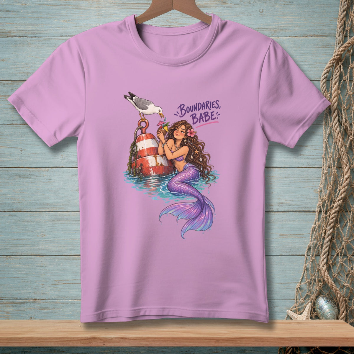 Pink t-shirt with mermaid, seagull, buoy, and text "BOUNDARIES, BABE".