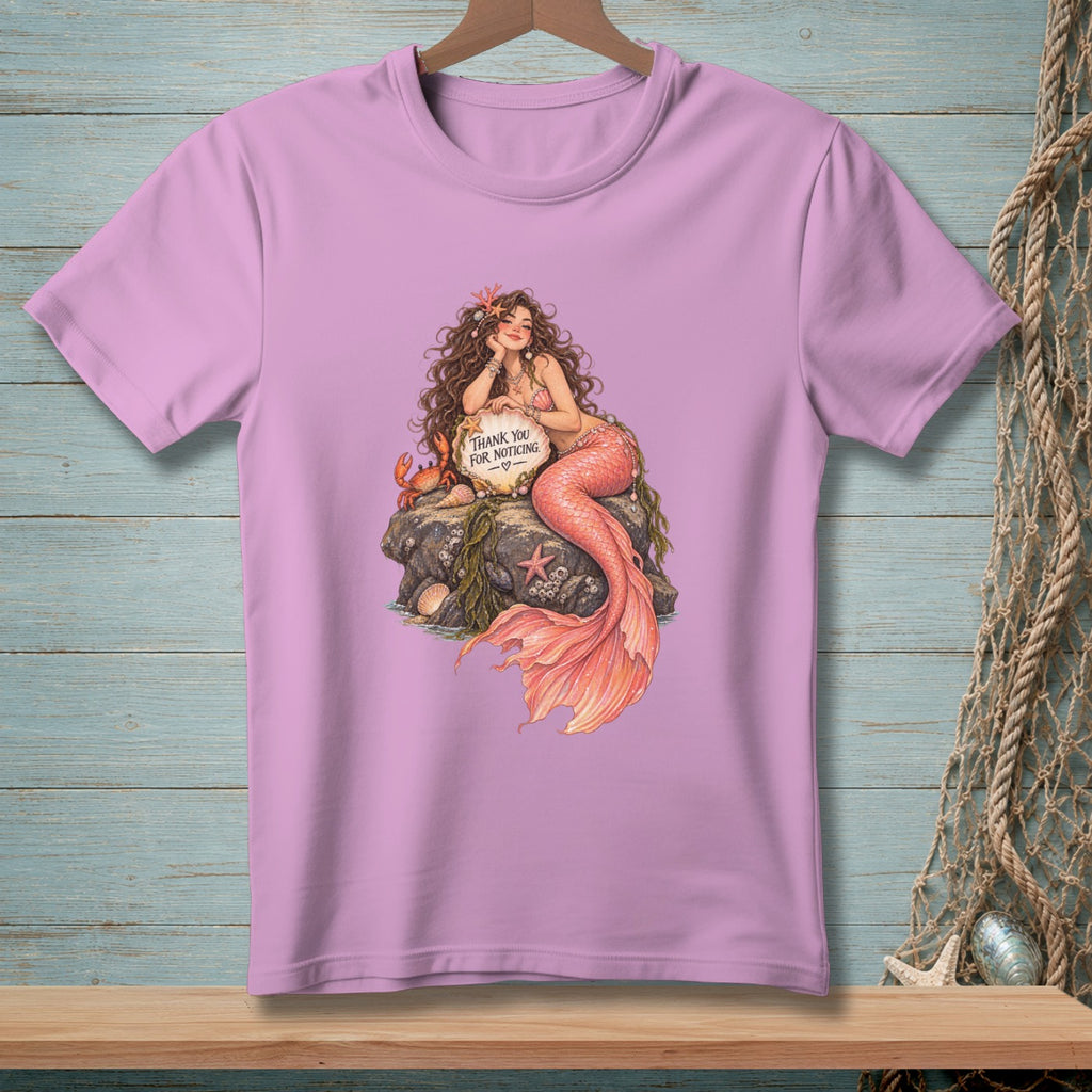 Mermaid sitting on a rock holding a sign that says "Thank You For Noticing".