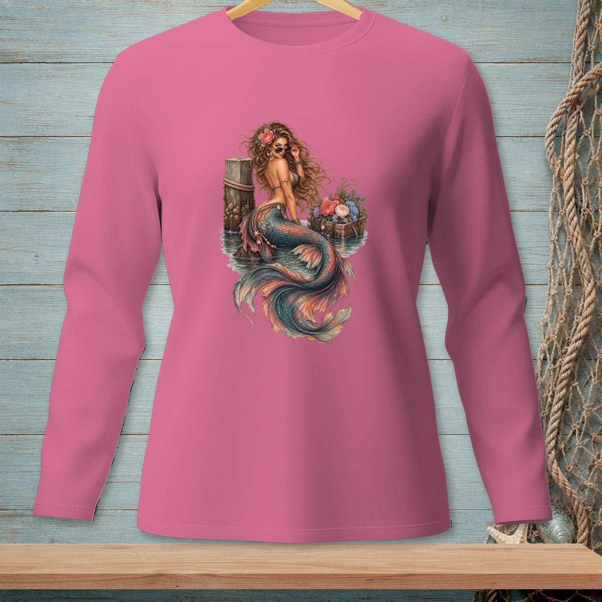 Long-sleeve pink shirt with a watercolor-style mermaid graphic.