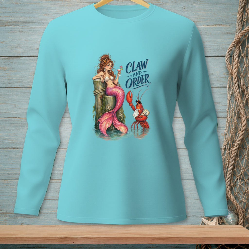 Mermaid and lobster graphic with "Claw and Order" text on a teal long-sleeve shirt.