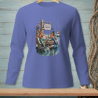 Long-sleeve shirt with two mermaids on a dock, a pelican, and a sign reading "Dockside Opinions."