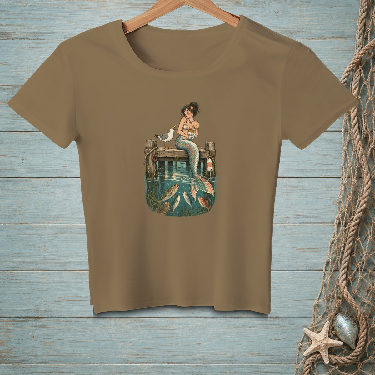 Mermaid and seagull on a dock, surrounded by fish in water, with "Fish & Chips" text.